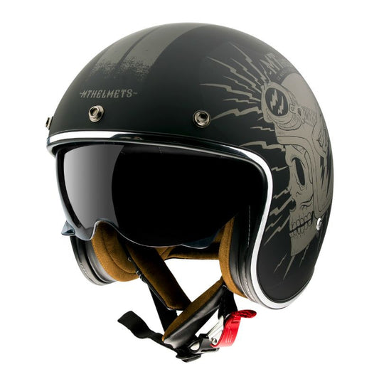 casque jet MT Helmets Le Mans noir mat, avec motif crâne stylisé et lunettes intégrées, style vintage