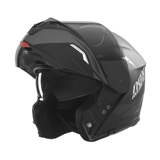 Casque NOX modulable noir avec visière solaire et look racing, idéal pour motards exigeants en confort et style