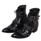 chaussures de motard en cuir noir vachette et porc avec finition reptile, talon surélevé, fermeture zippée et semelle antidérapante
