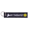 Porte-clé moto en tissu noir avec message "My Therapist" et smiley jaune, style biker