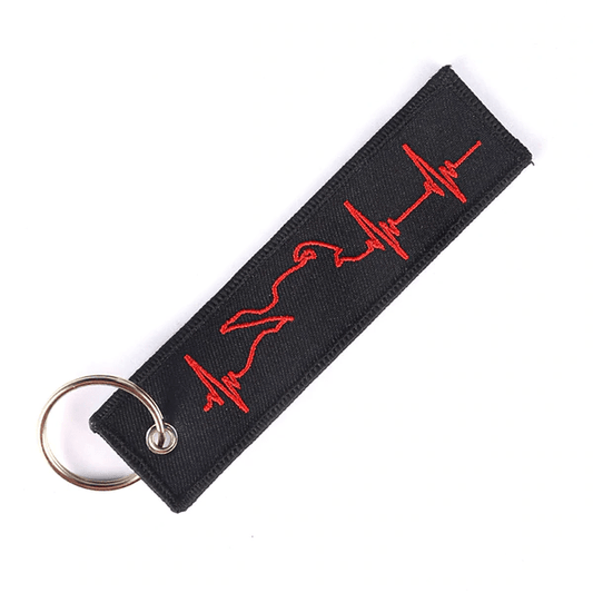 porte-clé moto biker en tissu noir avec broderie rouge en forme de battement de cœur et silhouette de moto